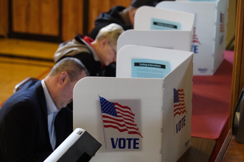 A line of voters cast their votes